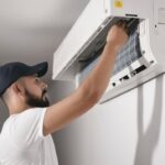 Male technician fixing air conditioner indoors, AI Generative